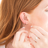 video of earrings being put on