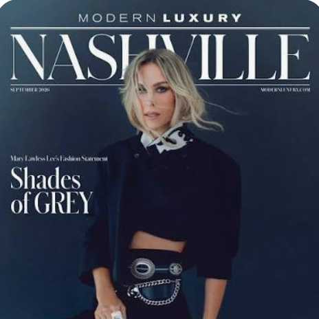 Nashville magazine cover featuring a blonde woman in a dark navy outfit with a patterned collar and a large silver ring, under the headline 'Shades of GREY'.